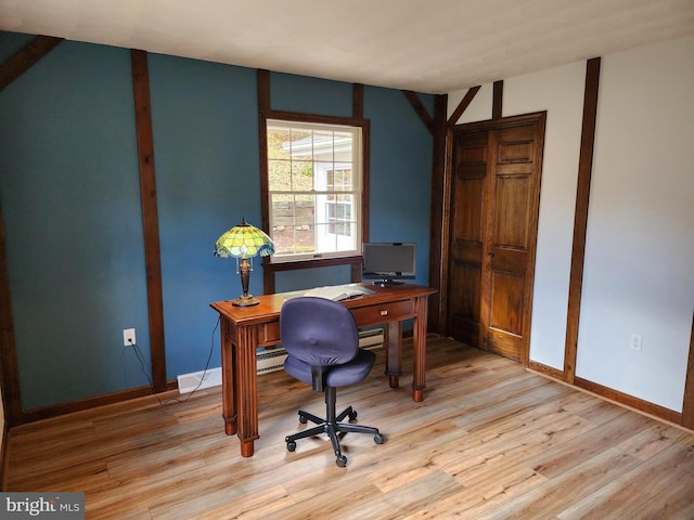 office with light hardwood / wood-style floors