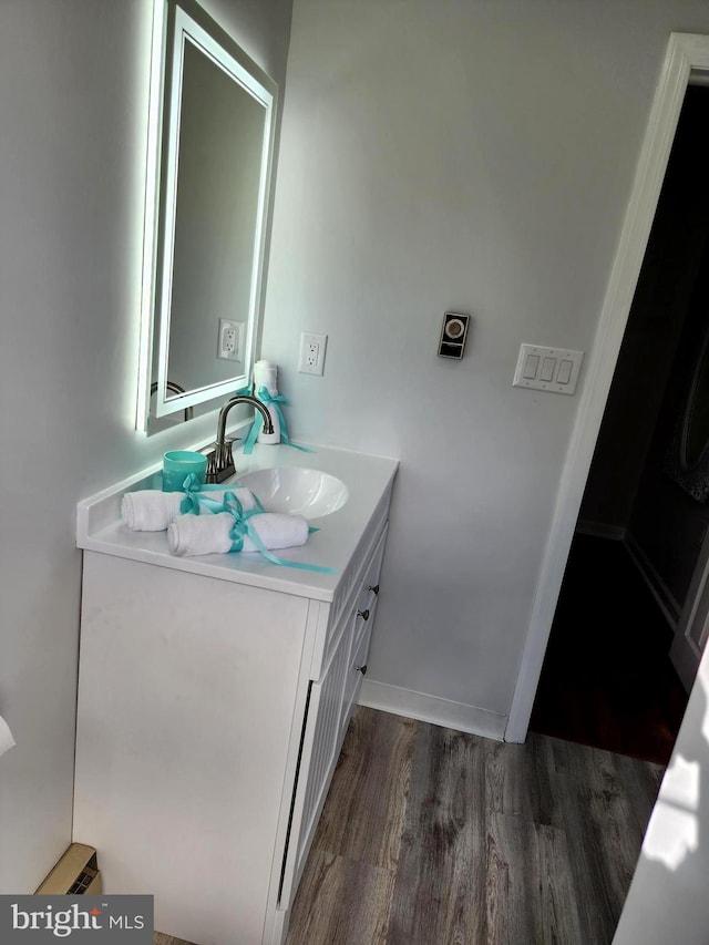 bathroom featuring vanity and wood-type flooring