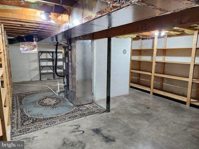 basement featuring heating unit