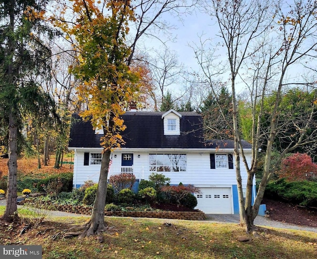 cape cod house with a garage