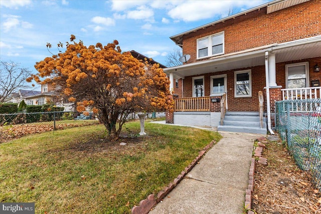 exterior space with a lawn and covered porch