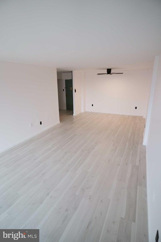 spare room featuring light wood-type flooring and ceiling fan