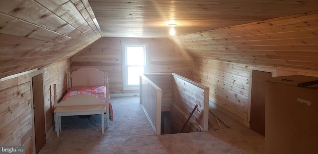 additional living space with wooden ceiling, vaulted ceiling, and wooden walls