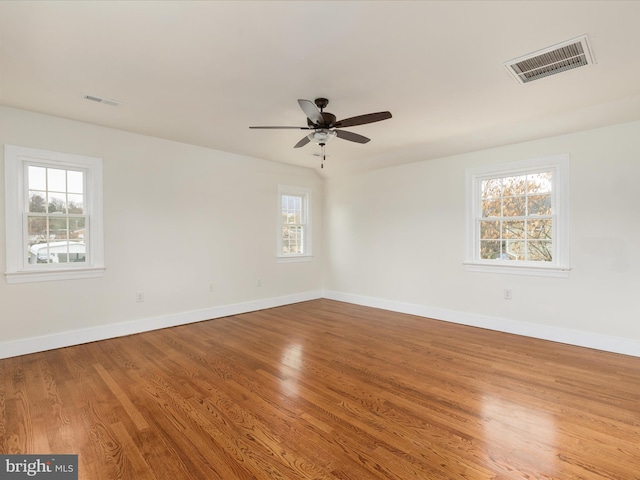 unfurnished room with wood-type flooring and ceiling fan