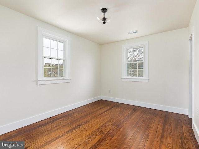 unfurnished room featuring hardwood / wood-style floors