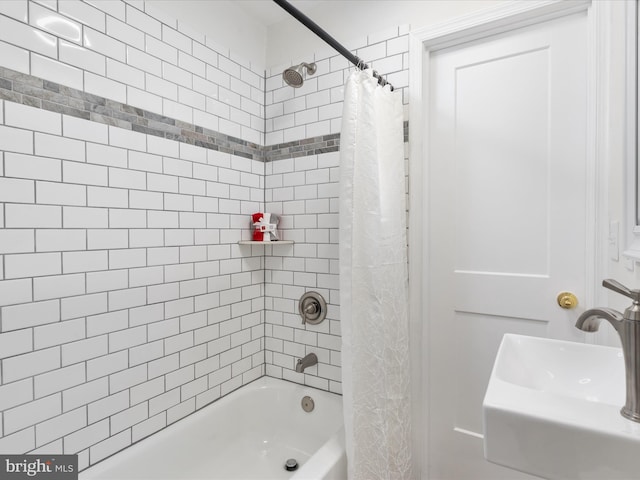 bathroom with sink and shower / tub combo