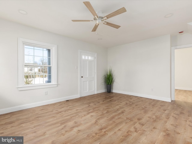 unfurnished room with ceiling fan and light hardwood / wood-style flooring