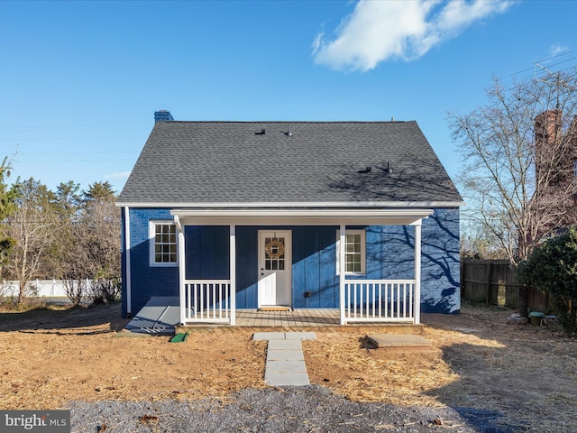 back of property featuring a porch