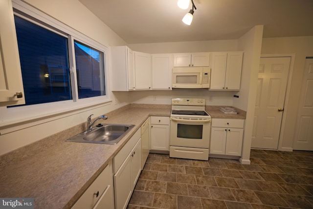 kitchen featuring white cabinetry, white appliances, and sink