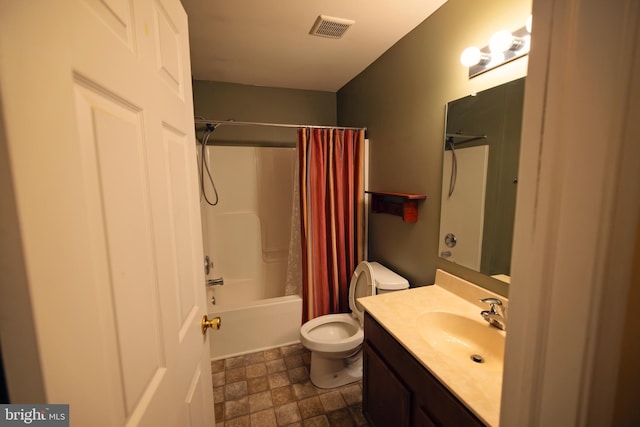 full bathroom with vanity, toilet, and shower / bath combo