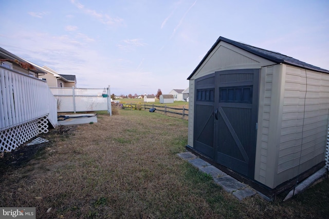 view of outdoor structure with a lawn