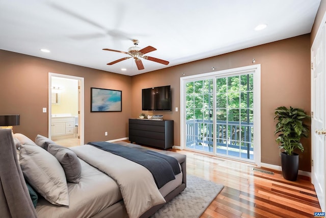 bedroom featuring access to outside, ceiling fan, ensuite bathroom, and light wood-type flooring