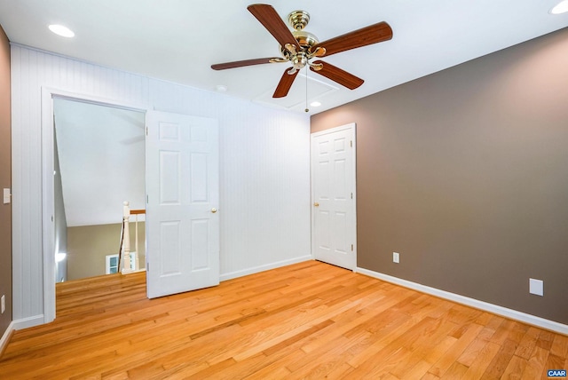 spare room featuring ceiling fan and light hardwood / wood-style flooring