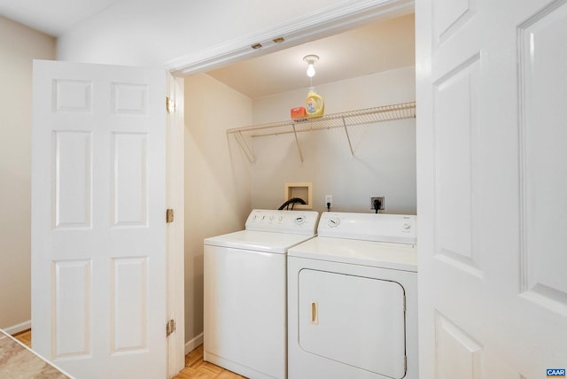 washroom featuring washing machine and clothes dryer