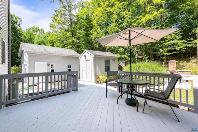 wooden deck featuring a storage unit