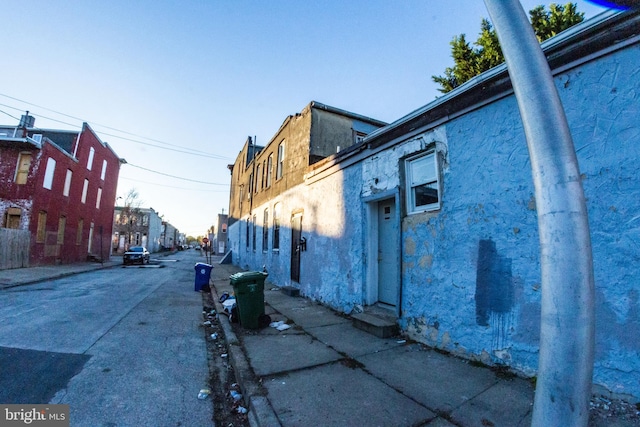 view of street with sidewalks and curbs