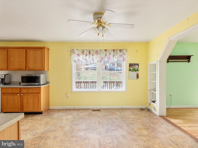 kitchen featuring light hardwood / wood-style flooring and ceiling fan