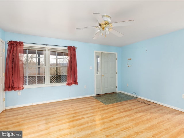 empty room featuring ceiling fan and light hardwood / wood-style floors