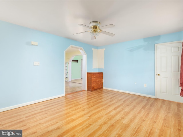 spare room with ceiling fan and light hardwood / wood-style floors