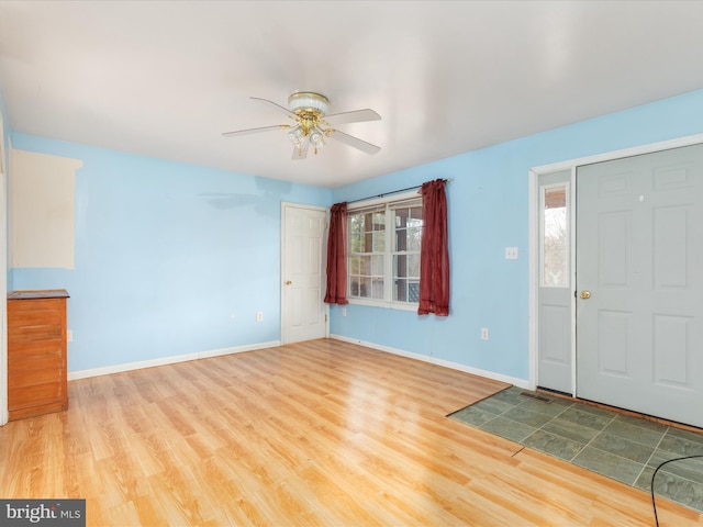 entryway featuring hardwood / wood-style flooring, ceiling fan, and a healthy amount of sunlight