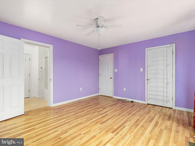 unfurnished bedroom with ensuite bath, ceiling fan, and light wood-type flooring