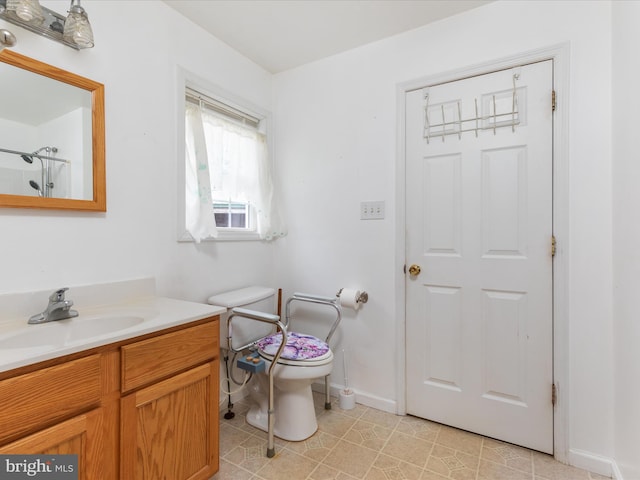 bathroom featuring tile patterned floors, vanity, toilet, and a shower