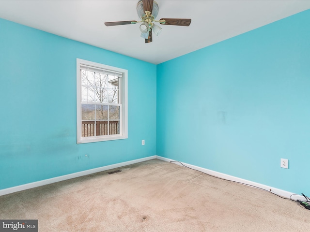 unfurnished room featuring carpet and ceiling fan