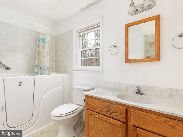 full bathroom featuring tile patterned floors, vanity, shower / tub combo, and toilet