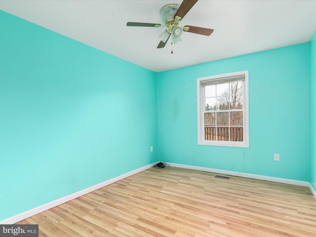 unfurnished room featuring light hardwood / wood-style floors and ceiling fan