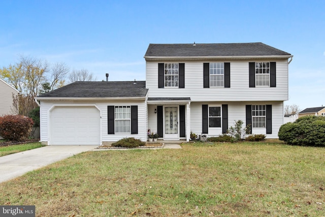 view of front of property featuring a front lawn and a garage