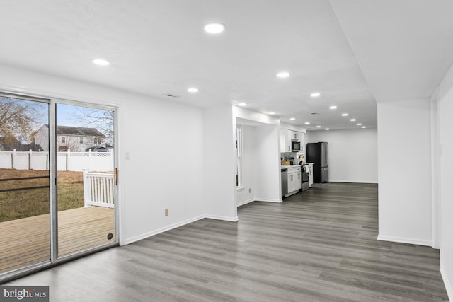 unfurnished living room featuring dark hardwood / wood-style flooring