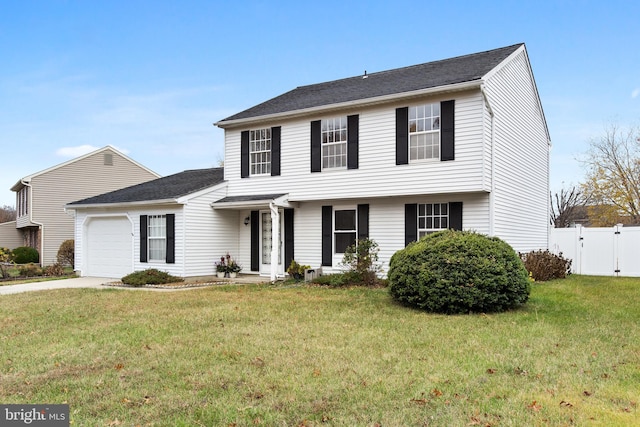 view of front of house with a garage and a front lawn