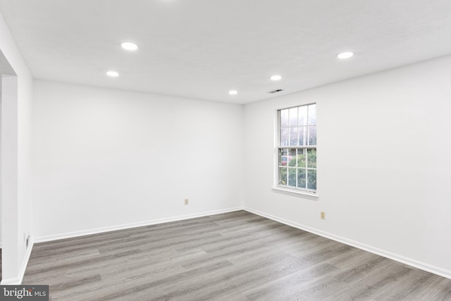 spare room featuring light hardwood / wood-style floors