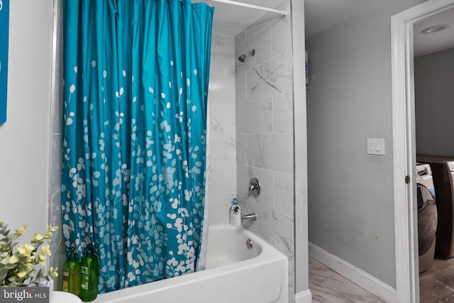 bathroom featuring shower / tub combo with curtain and washer / dryer