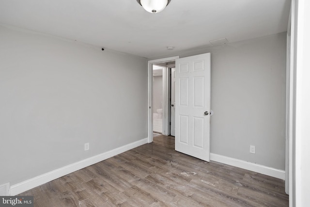 empty room featuring hardwood / wood-style floors