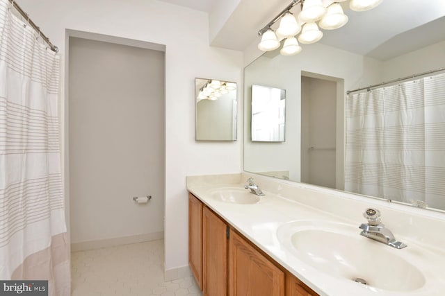 bathroom with tile patterned flooring and vanity