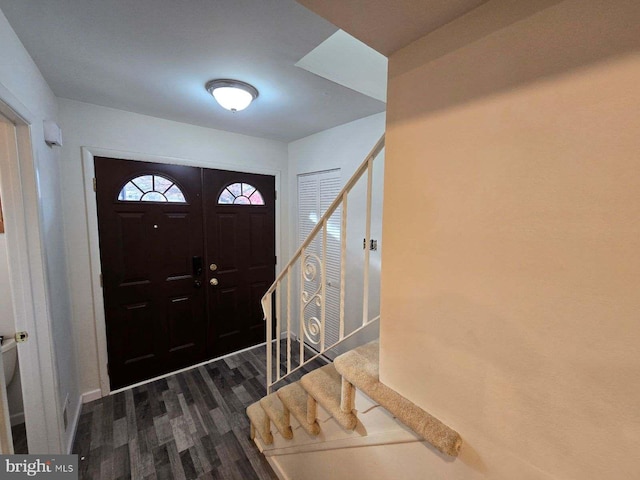 foyer with dark hardwood / wood-style floors