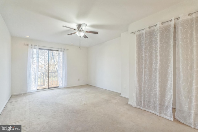 carpeted empty room with ceiling fan