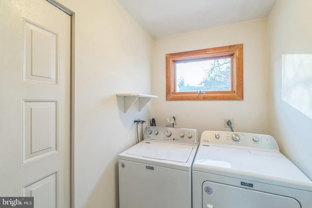 clothes washing area with washer and dryer