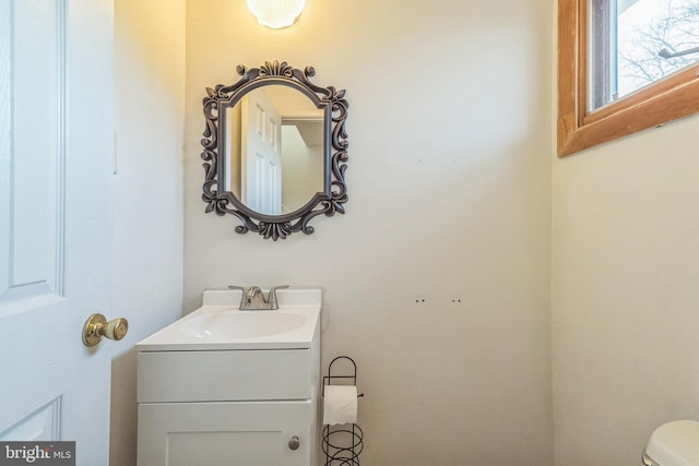 bathroom with vanity and toilet