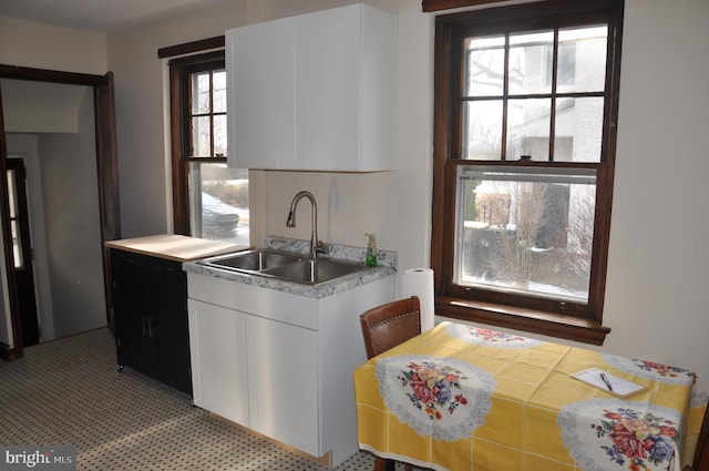 kitchen with sink and white cabinets