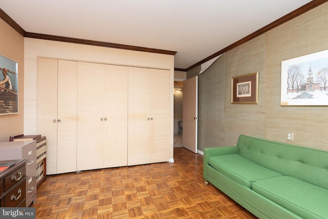 sitting room with dark parquet flooring and ornamental molding