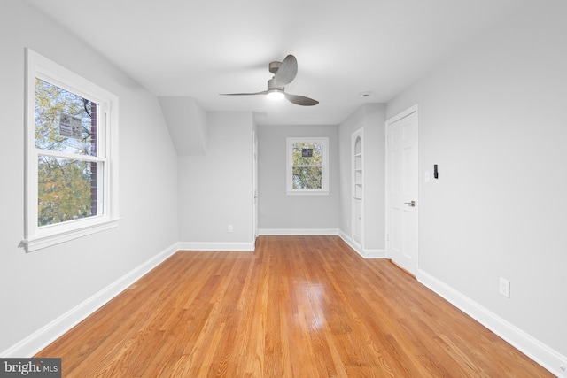 unfurnished room with ceiling fan and light hardwood / wood-style floors