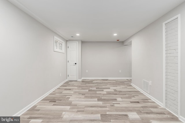 basement featuring light hardwood / wood-style flooring