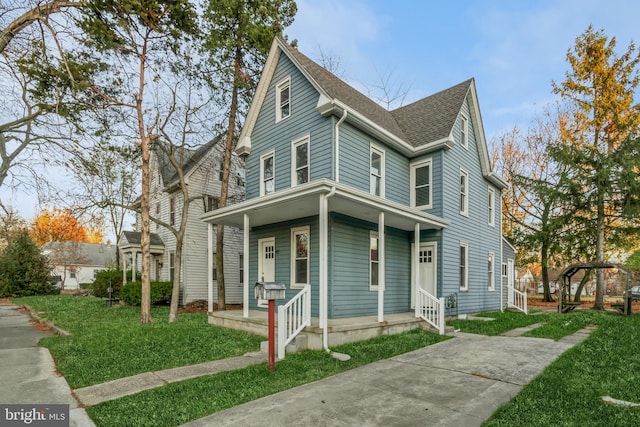 view of front of house with a front lawn and a porch