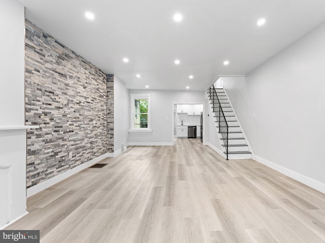 unfurnished living room featuring light hardwood / wood-style floors