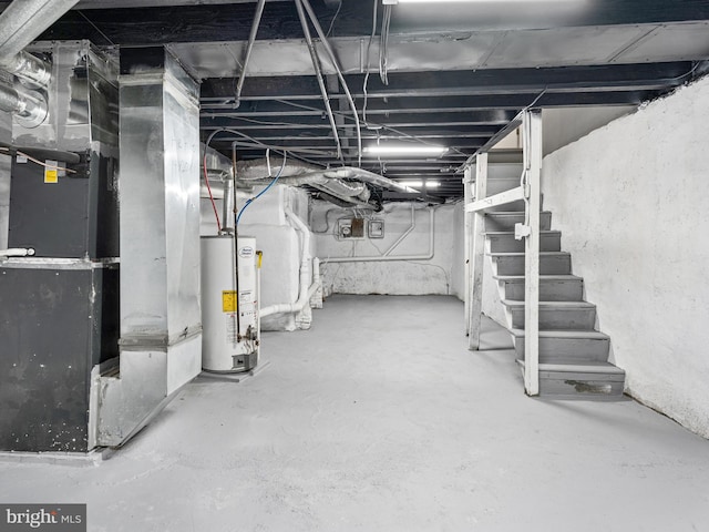 basement featuring gas water heater and heating unit