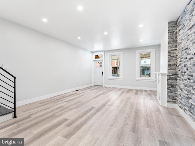 unfurnished living room featuring light hardwood / wood-style floors