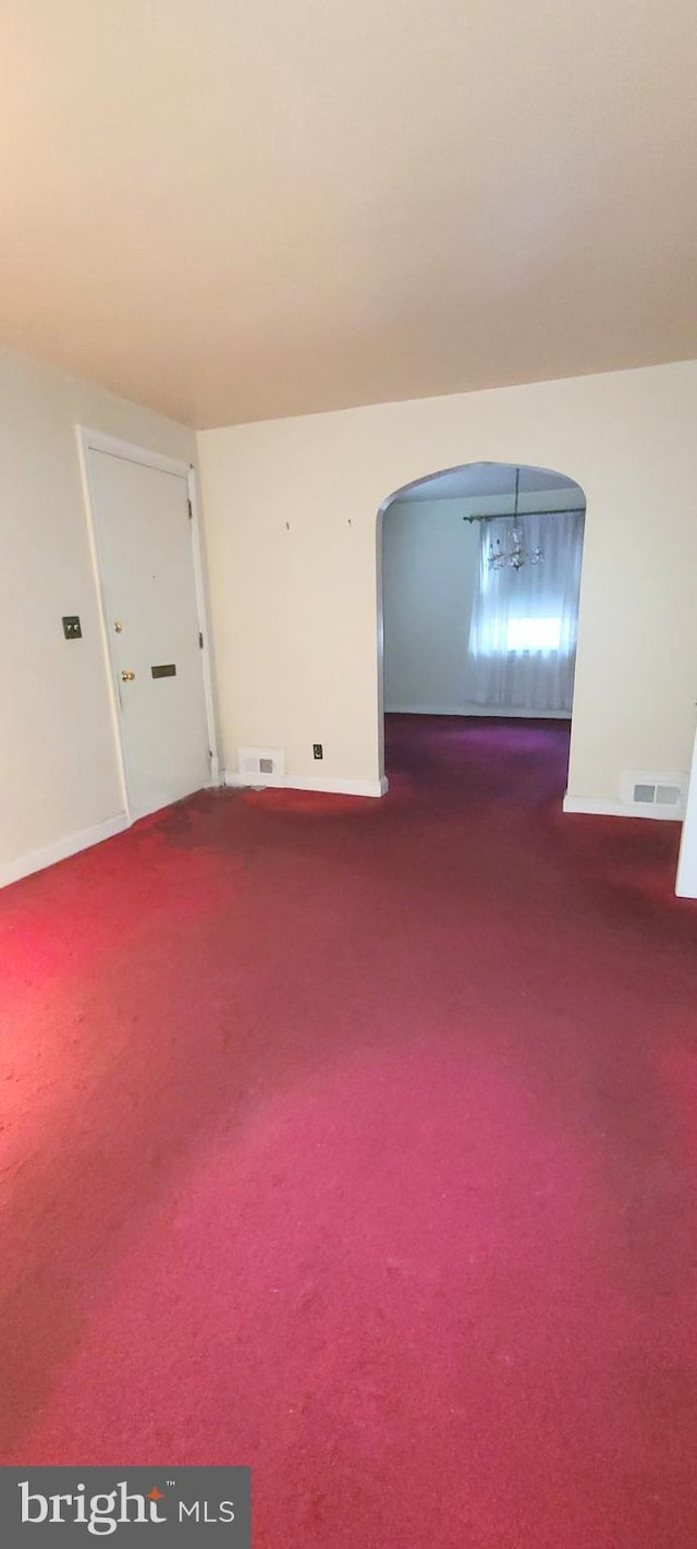 empty room featuring carpet flooring