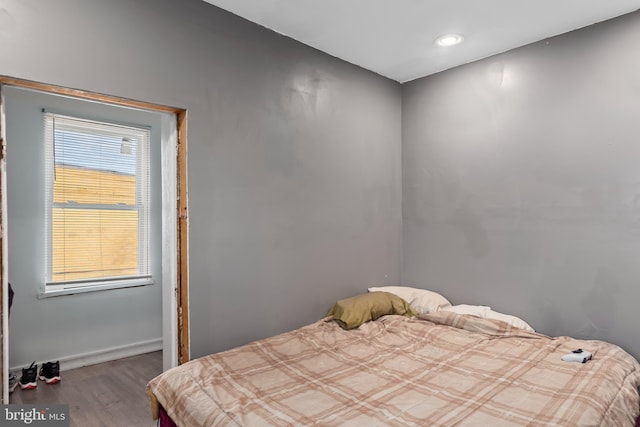 bedroom featuring wood-type flooring